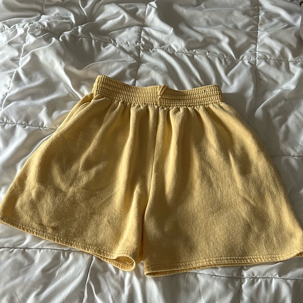 Yellow soft athletic shorts. Size large.